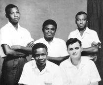 Early Bahá’ís in Cameroon. Front (left to right): Enoch Olinga, Ali Nakhjavani. Back (left to right): Benedict Eballa, David Tanyi, and Samuel Njiki, 1954.