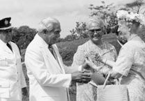 Madame Ruhiyyih Rabbani, a Hand of the Cause of God, (right) is greeted by the Head of State of Samoa, His Highness Susuga Malietoa Tanumafili II, and his wife, Masiofo Lili Tuni Malietoa, at the dedication of the Baha'i Samoan Temple, 1984.